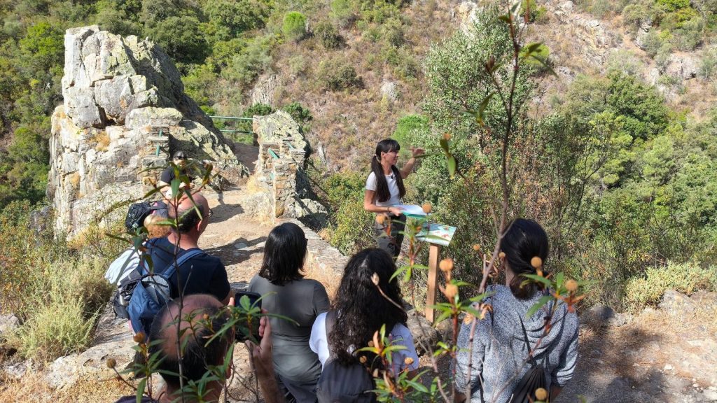 Dr Helena Chacón interprets the landscape from the viewpoint on the Los Molinos GeoTrail, in Alájar