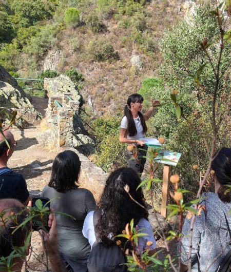 Dr Helena Chacón interprets the landscape from the viewpoint on the Los Molinos GeoTrail, in Alájar